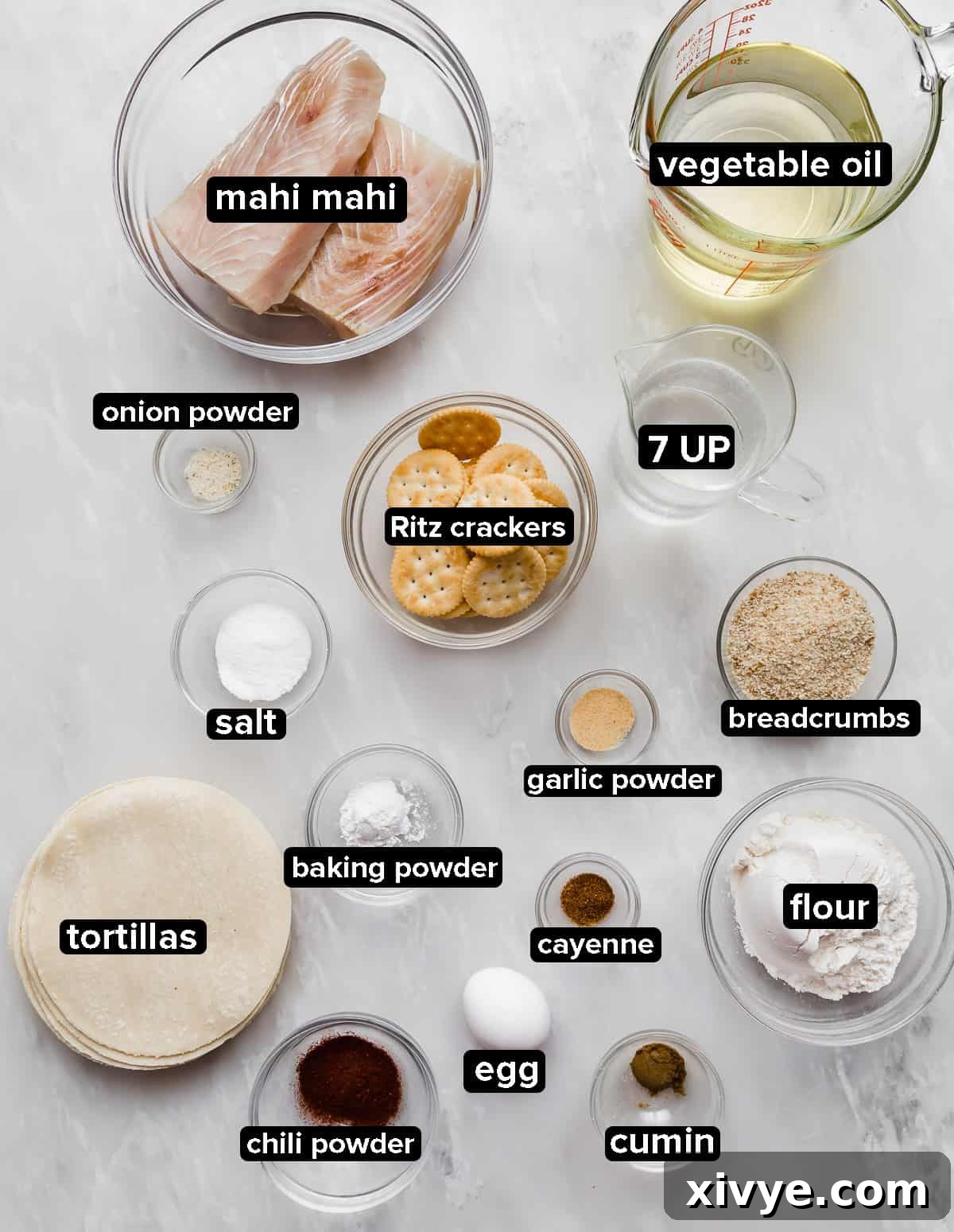 Authentic Baja Fish Taco ingredients on a marble background.