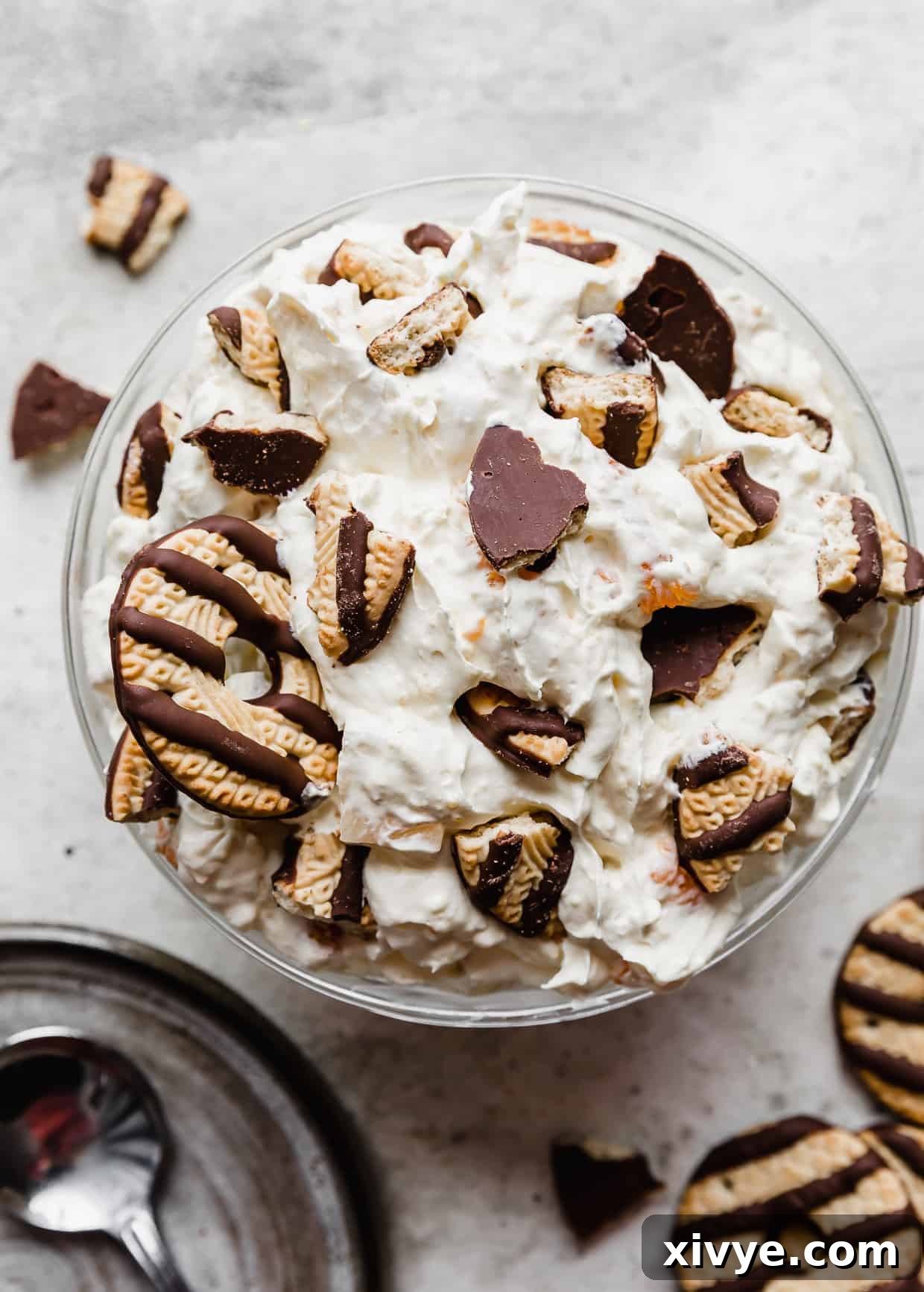 A bowl of cookie salad topped with crumbled fudge stripe cookies.