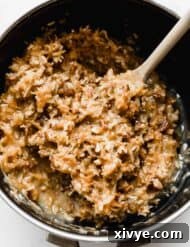 Decadent Coconut Pecan Dream 12 A saucepan with fresh made German Chocolate Cake Frosting in it.