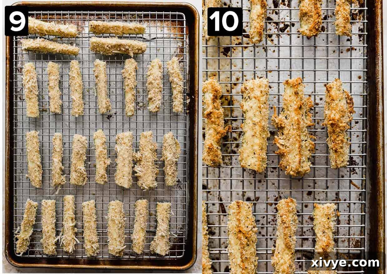 Baking sheet with coated zucchini fries on it.