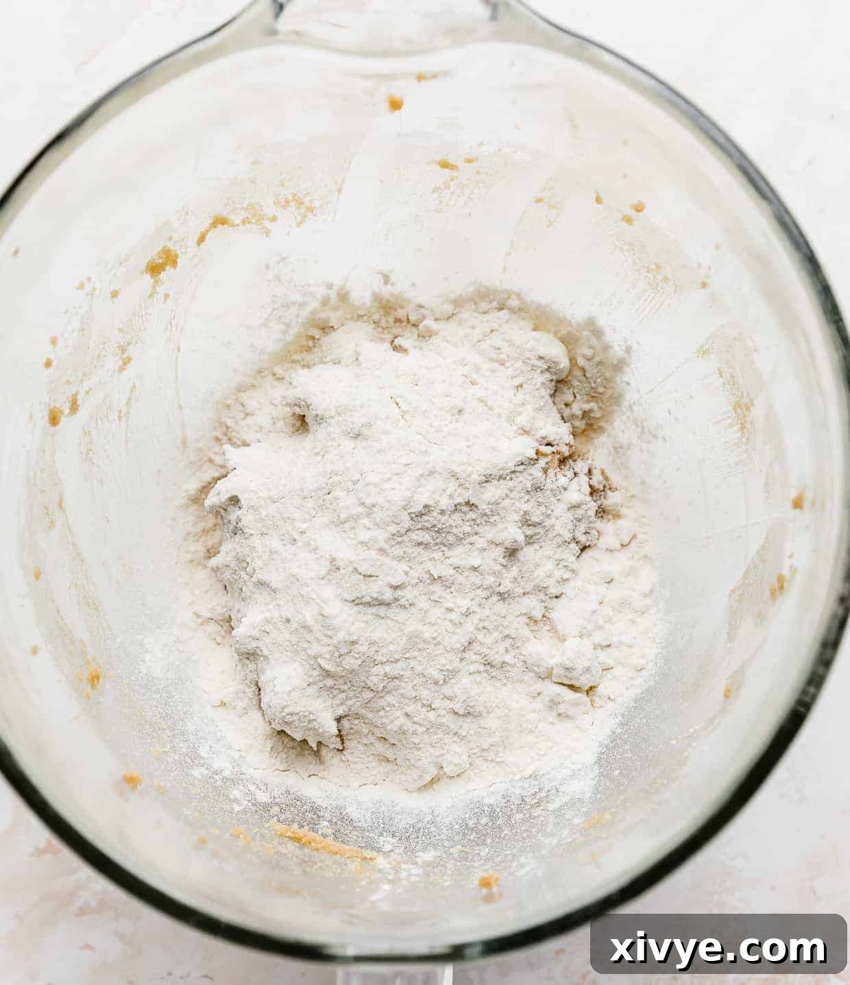 Ben and Jerrys Irresistible Cookie Dough Bites 7 A glass bowl with white flour in it.