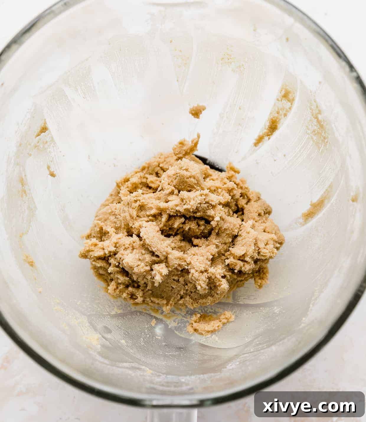 Ben and Jerrys Irresistible Cookie Dough Bites 8 Edible cookie dough in a glass bowl, minus the chocolate chips.