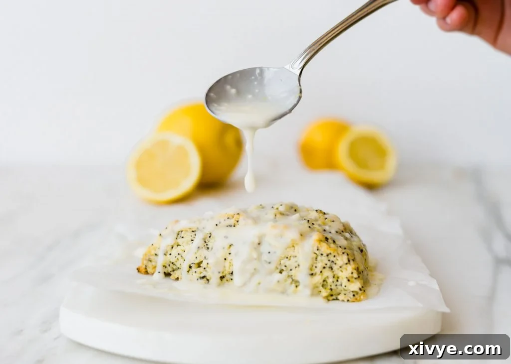 These Lemon Poppy Seed Scones are the perfect spring and summer treat! They are loaded with the perfect lemon flavor and topped with an irresistible glaze! 