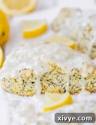 Sunshine Lemon Poppy Scones 8 These Lemon Poppy Seed Scones are the perfect spring and summer treat! They are loaded with the perfect lemon flavor and topped with an irresistible glaze!