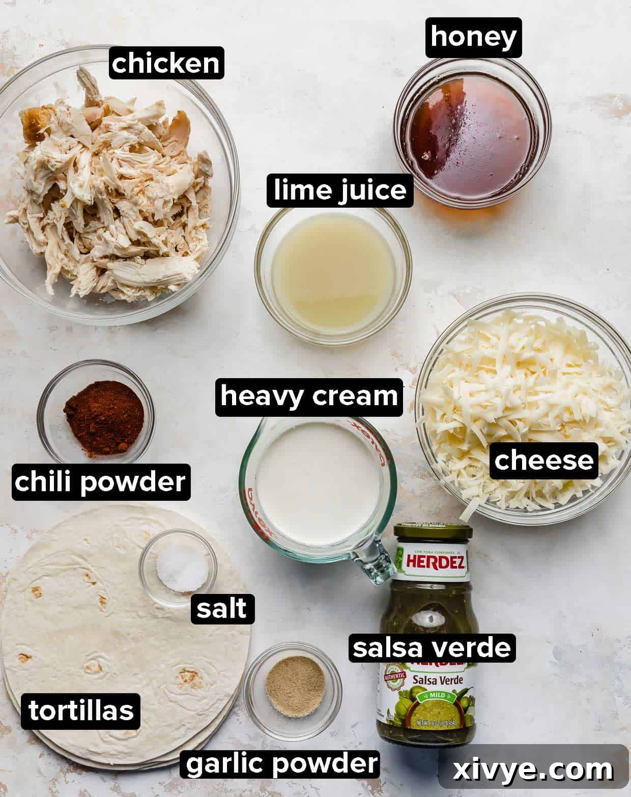 Golden Honey Lime Chicken Enchiladas 3 Honey Lime Chicken Enchilada ingredients portioned into glass bowls on a white background.