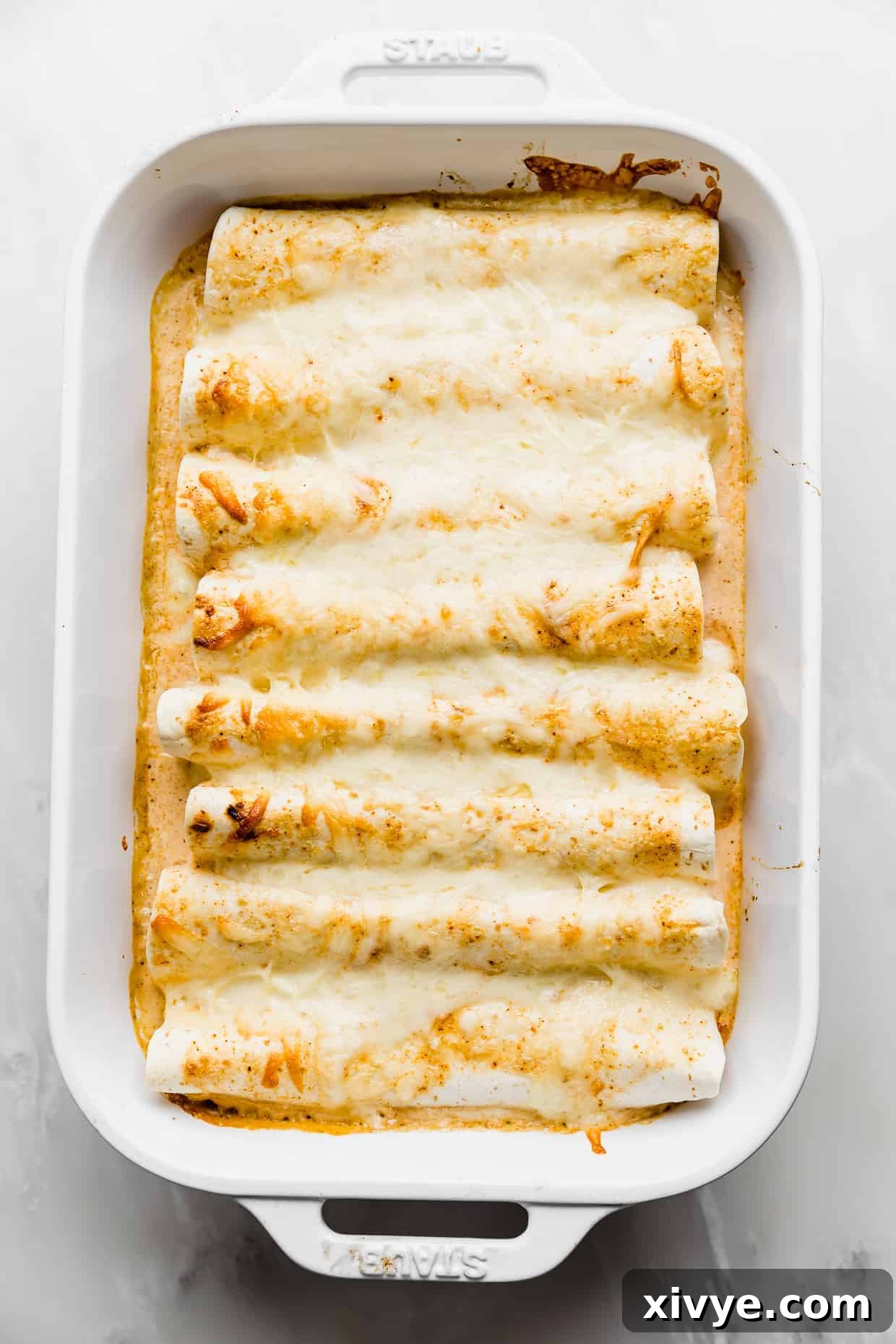 Golden Honey Lime Chicken Enchiladas 7 Baked Sweet Lime Chile Enchiladas in a cream and orange colored sauce topped with golden cheese.