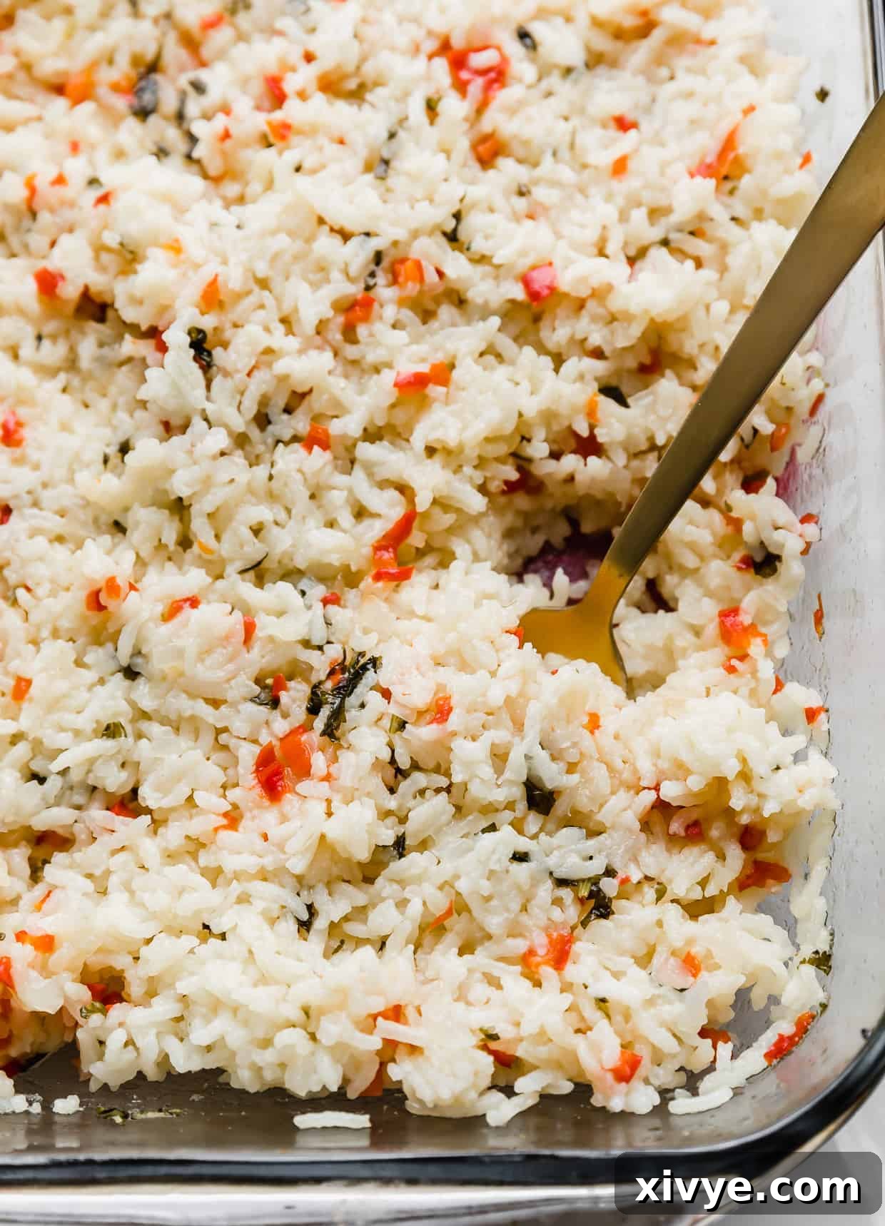 Sweet Bell Pepper Pilaf 6 A gold spoon in a pile of red pepper studded Sweet Pepper Rice.