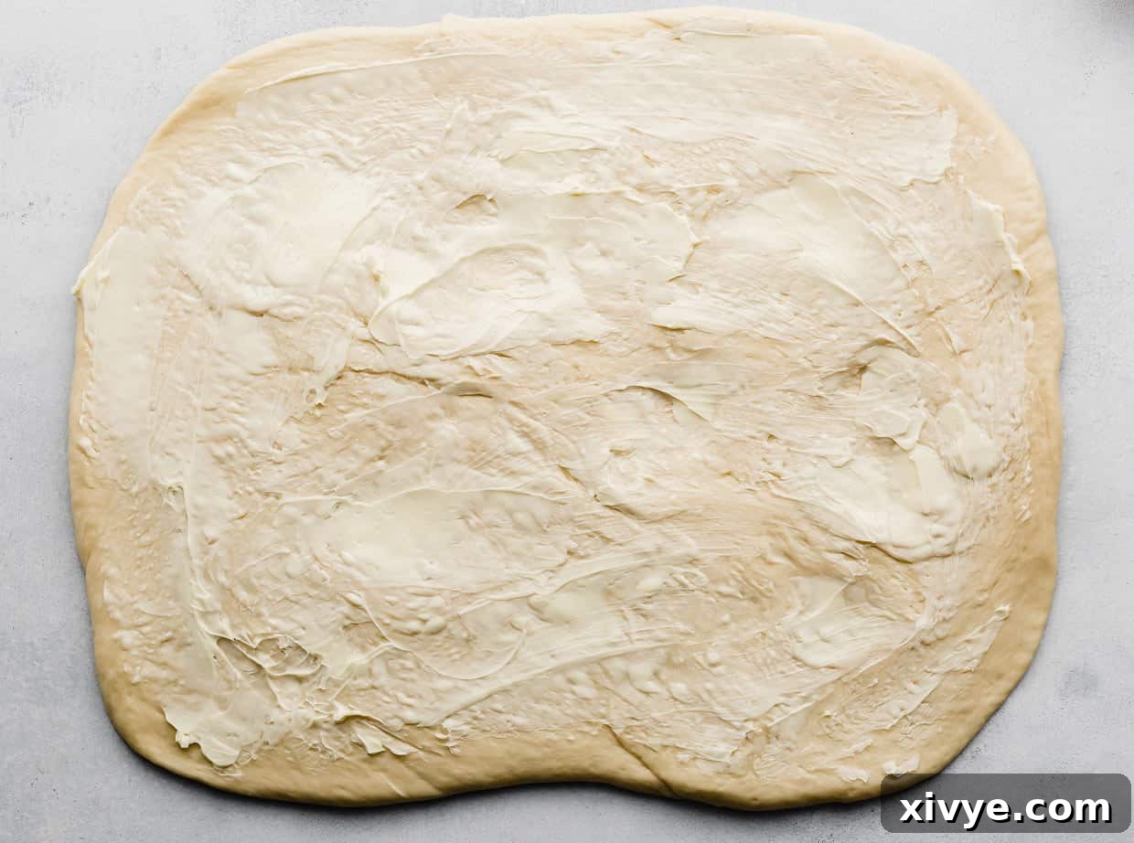 Rolled dough smeared with softened butter.