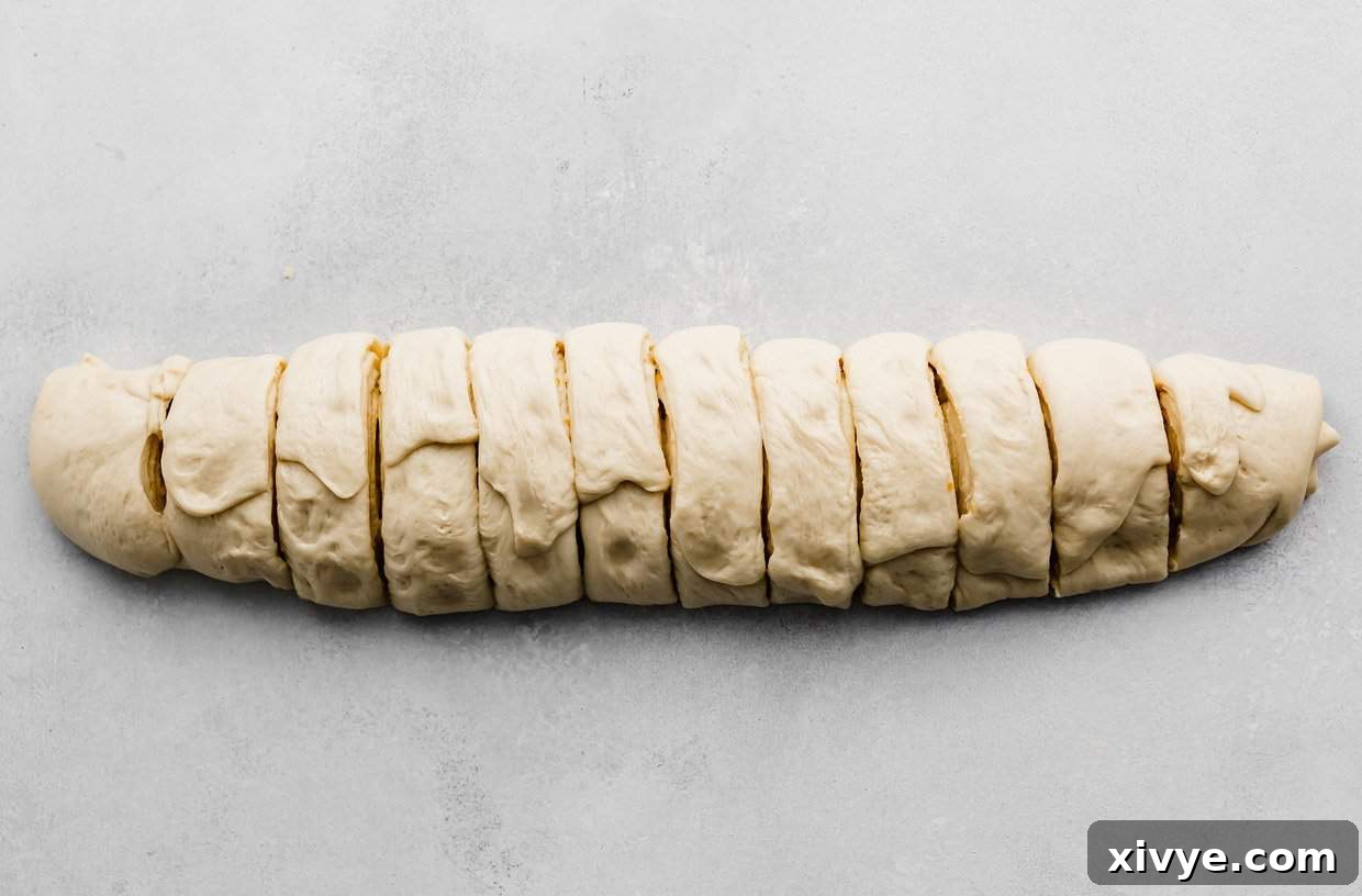 Orange cinnamon roll log  cut into 12 pieces.