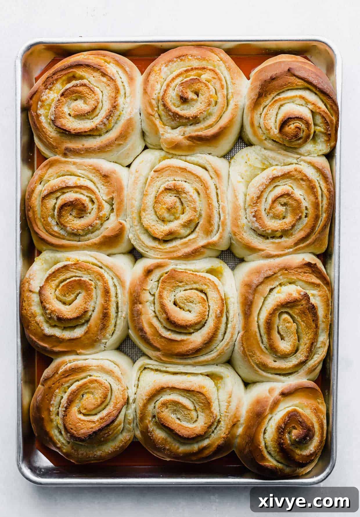 Baked Orange Rolls on a baking sheet.