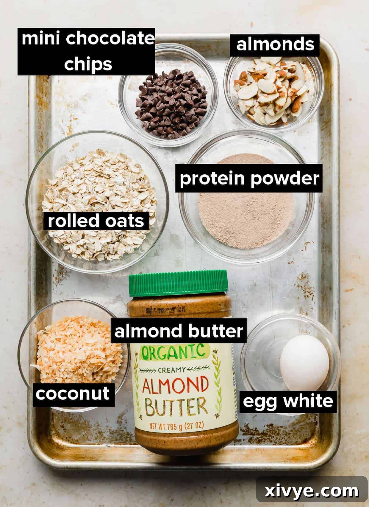 Ingredients used to make Almond Joy Oatmeal on a baking sheet.