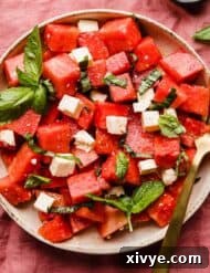 A Watermelon Feta Basil Salad close up in a bowl.