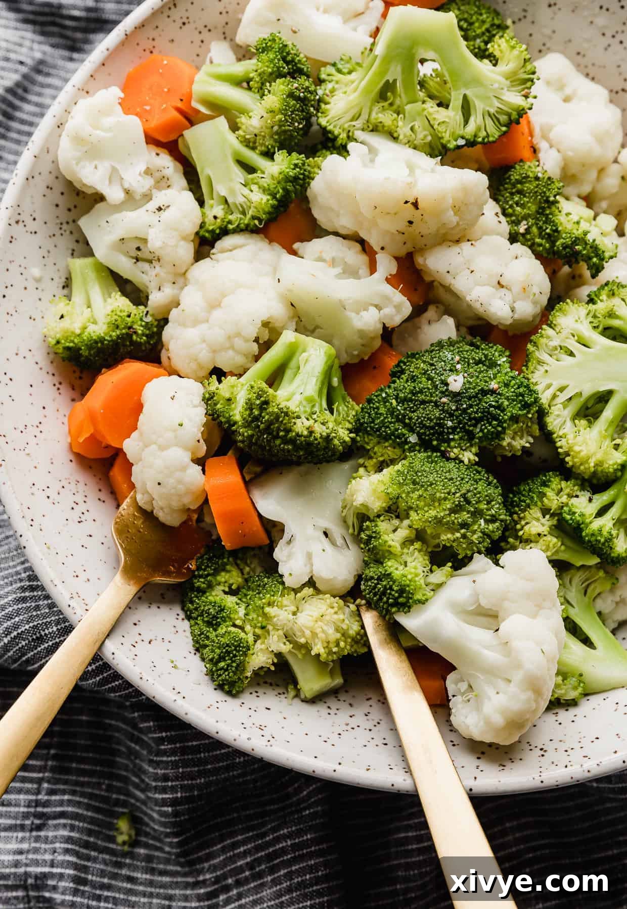 Close up photo of Buttered Vegetables, broccoli, cauliflower florets, and carrots.
