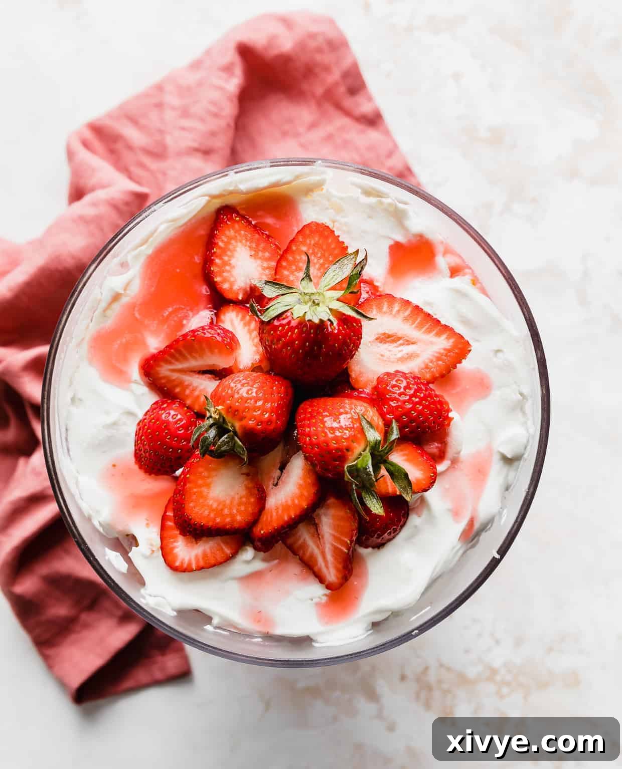 Overhead photo of a Strawberry Shortcake Trifle topped with sliced strawberries.