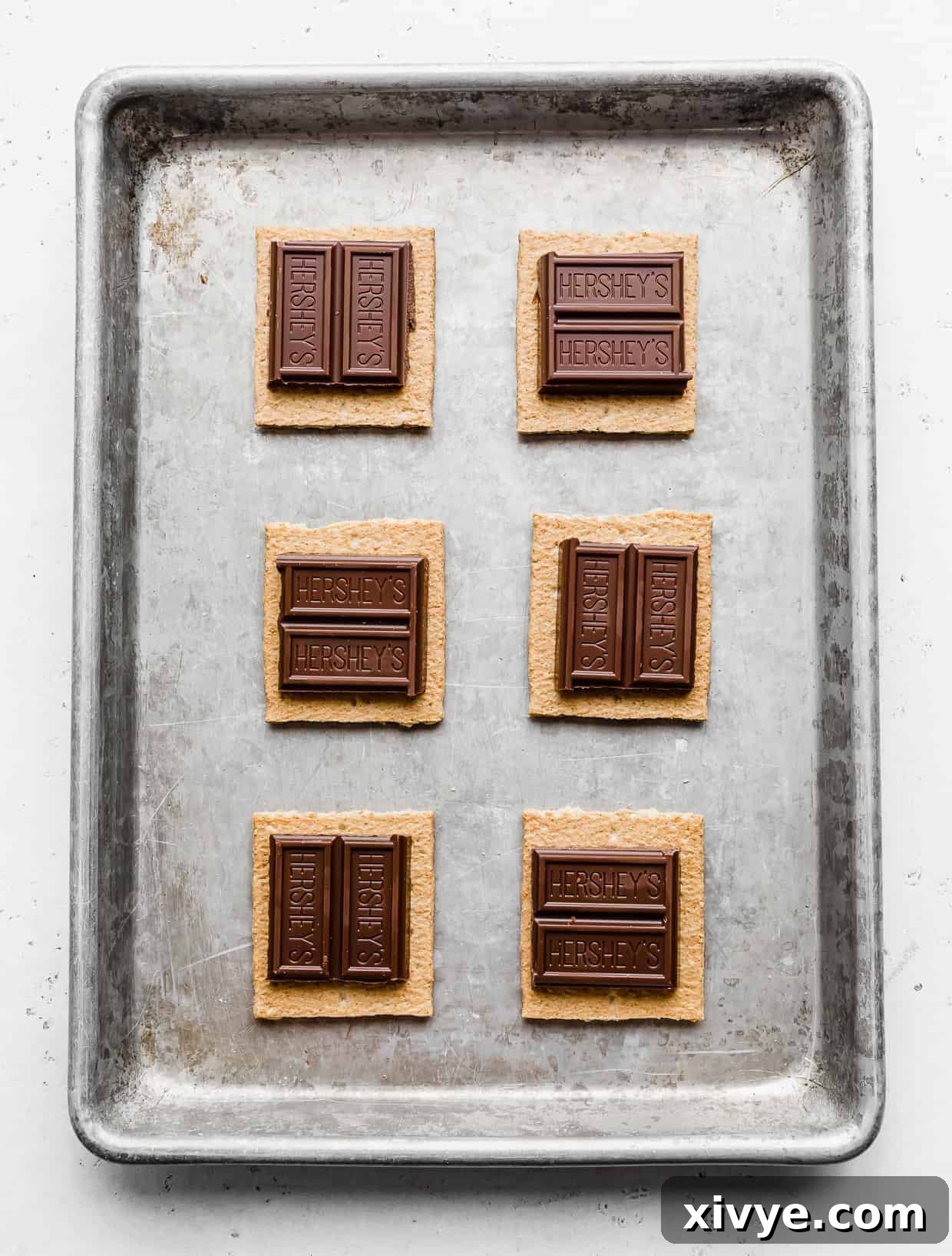 Chocolate Hershey's squares on top of graham cracker squares.