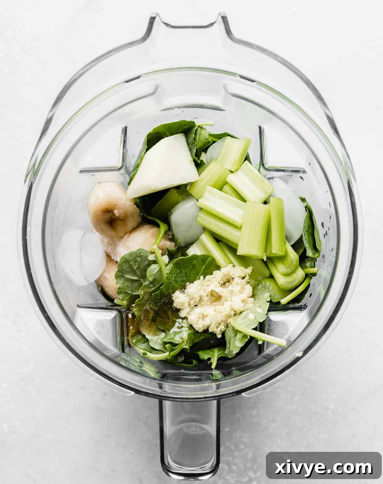 Ingredients used to make a celery smoothie in a blender. 