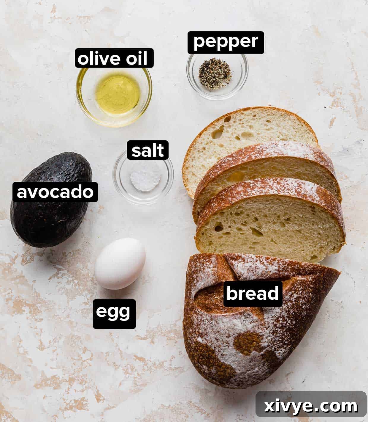 Creamy Avocado Egg Toast 3 Ingredients used to make Avocado and Egg Toast, including bread, avocado, eggs, and seasonings.