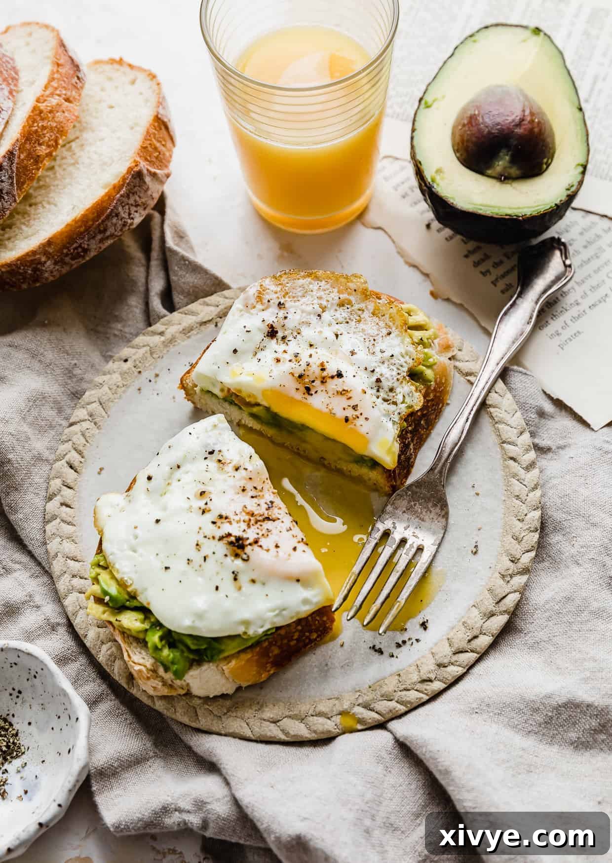 Creamy Avocado Egg Toast 9 A beautifully presented slice of toasted bread with smashed avocado and a perfectly cooked egg on it, ready for a healthy meal.