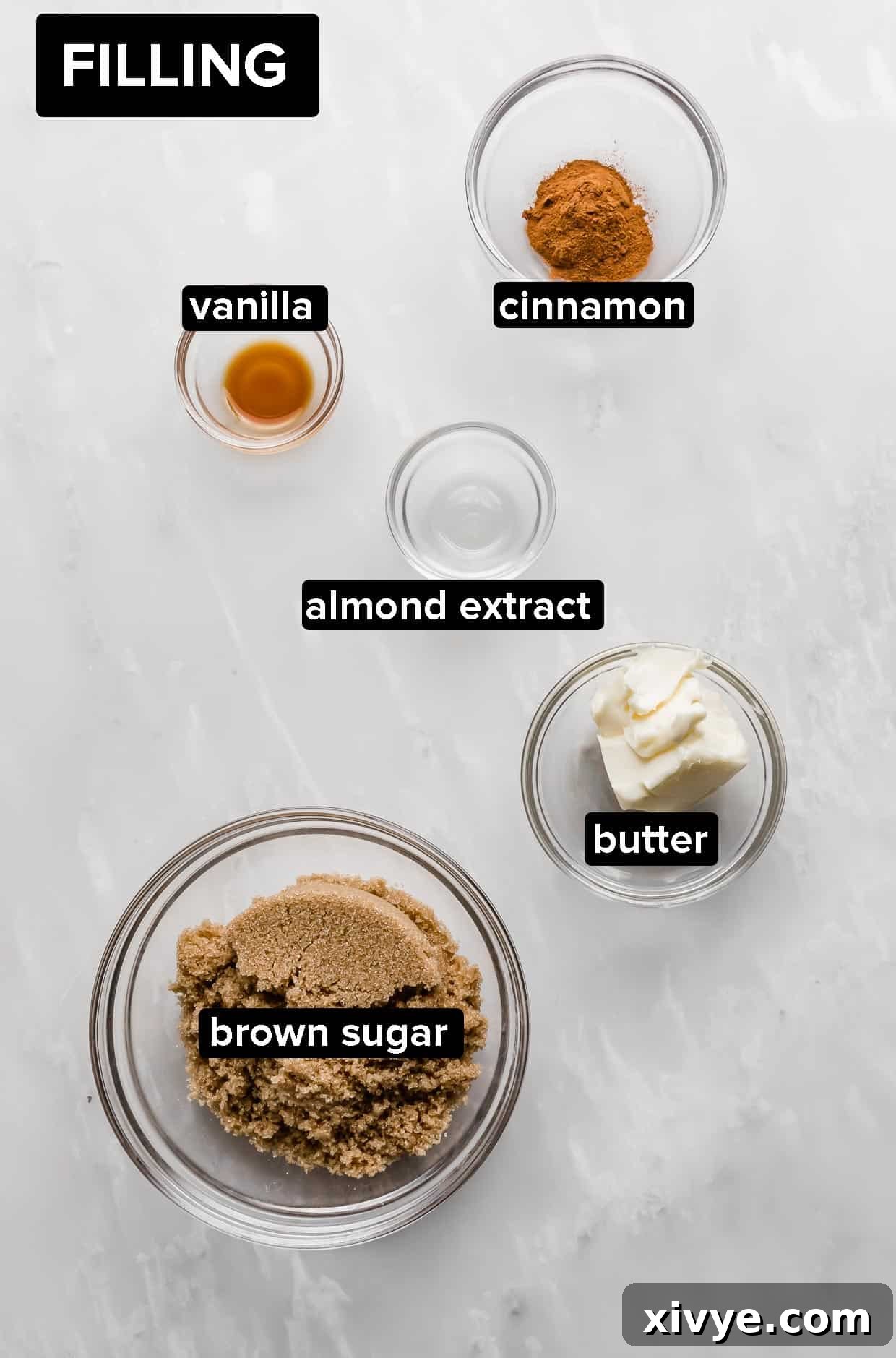 Irresistible Mini Cinnies 4 Closeup of brown sugar, cinnamon, vanilla, and almond extract in a bowl, ready for the filling.