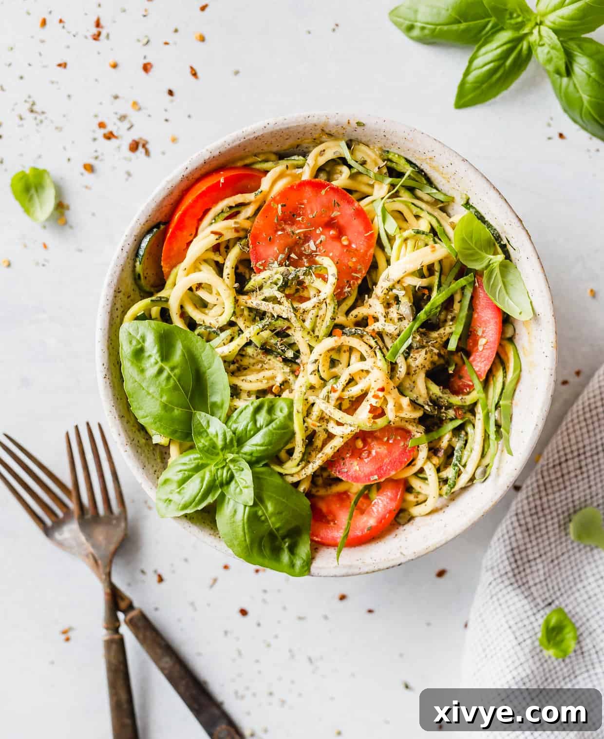 Sun-Kissed Zucchini Pasta 7 Zucchini noodles are used to make this 5-Minute Cheesy Zucchetti Bowl! Topped with bright red tomatoes, fresh basil, and Italian seasoning this dish is delicious!