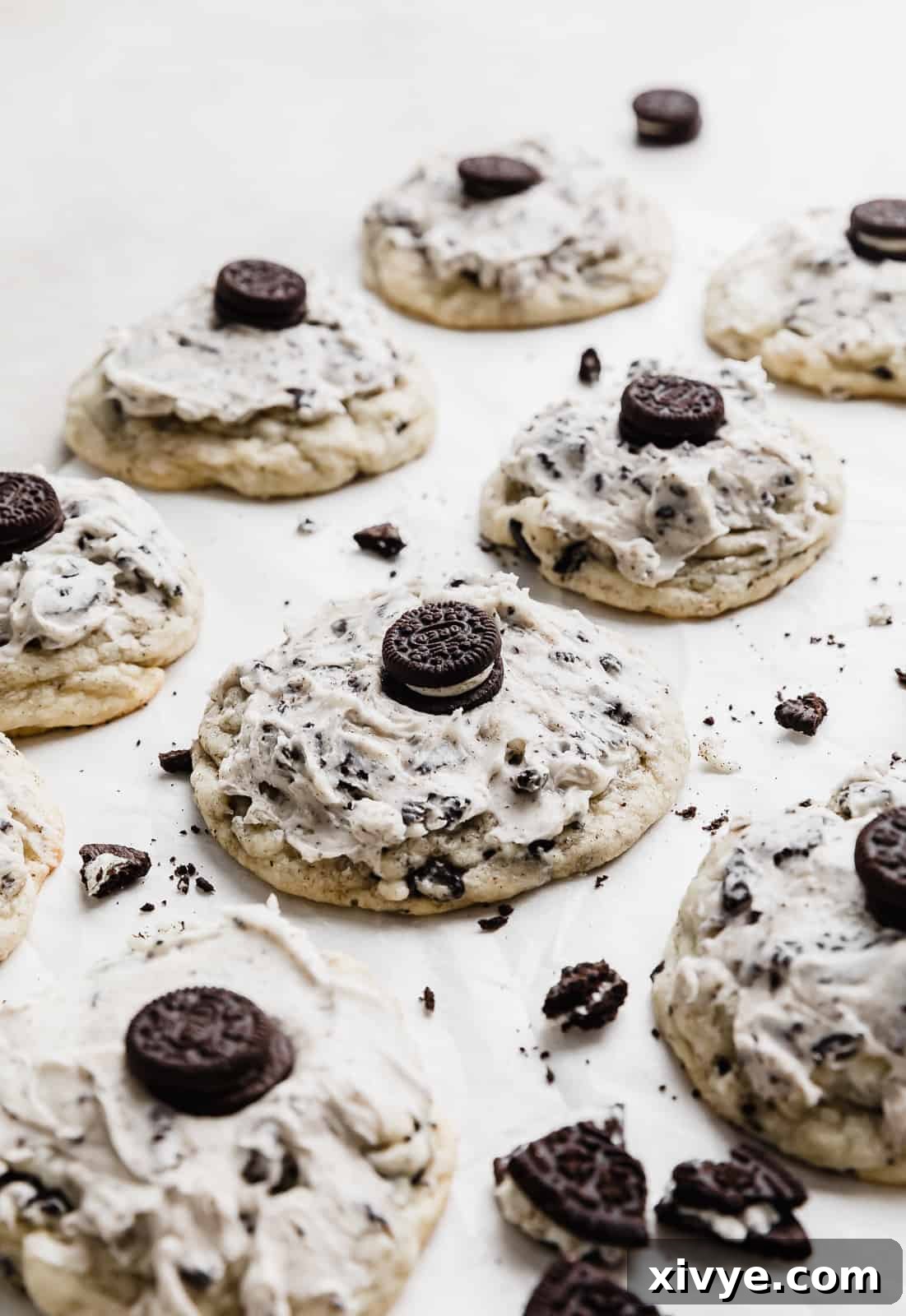A copycat Crumbl cookies and cream milkshake cookie with a mini Oreo on top, showcasing its rich frosting and iconic topping.