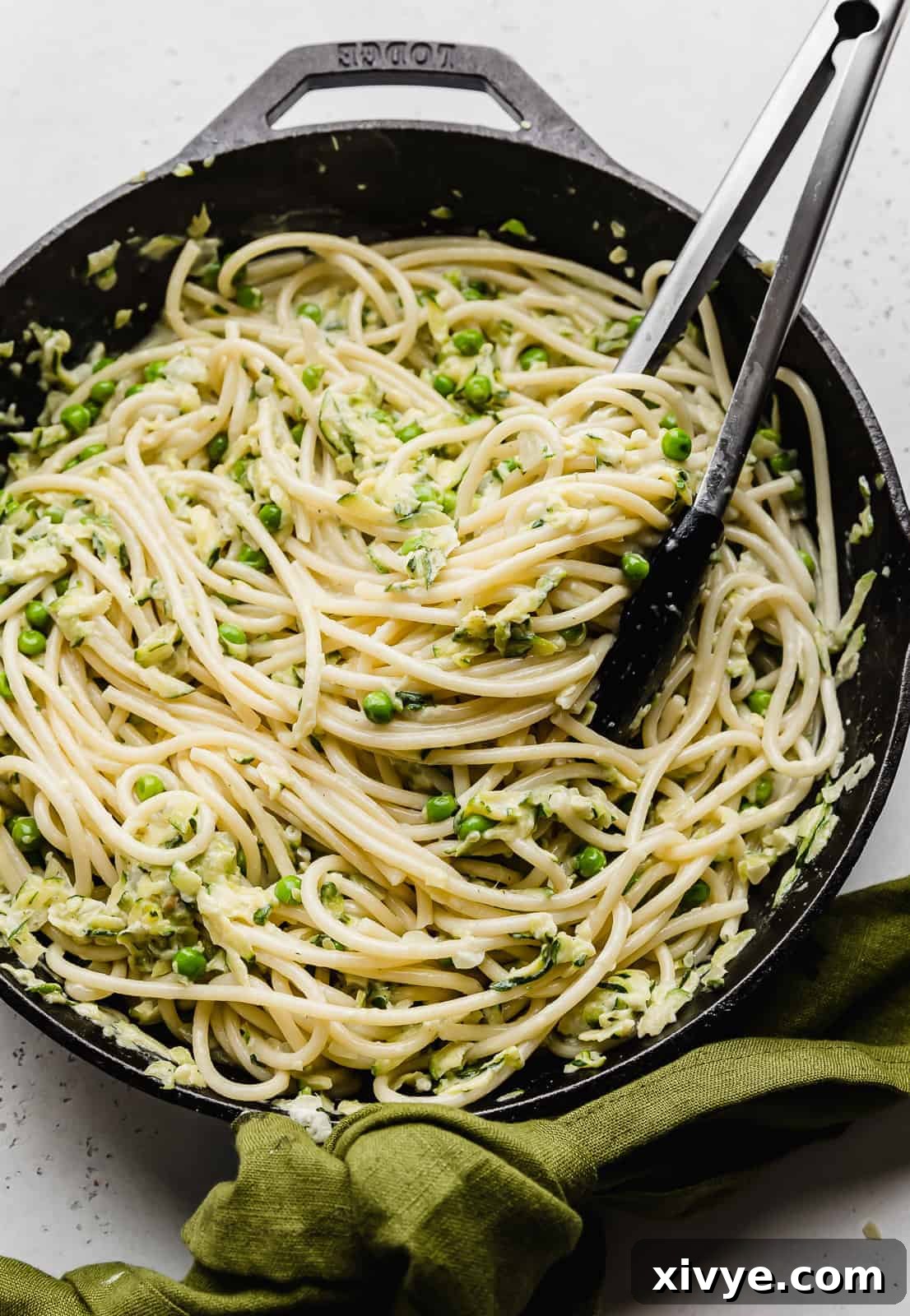 Creamy Zucchini Pasta 13 Close up photo of Pasta with Zucchini Sauce in a black skillet, ready to be served.