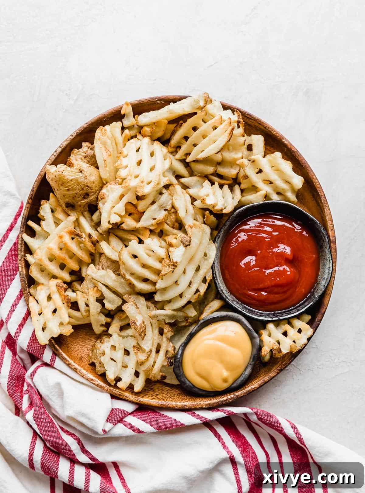 Crispy Waffle Fries from Your Air Fryer 7 Leftover waffle fries stored in an airtight container for future reheating.