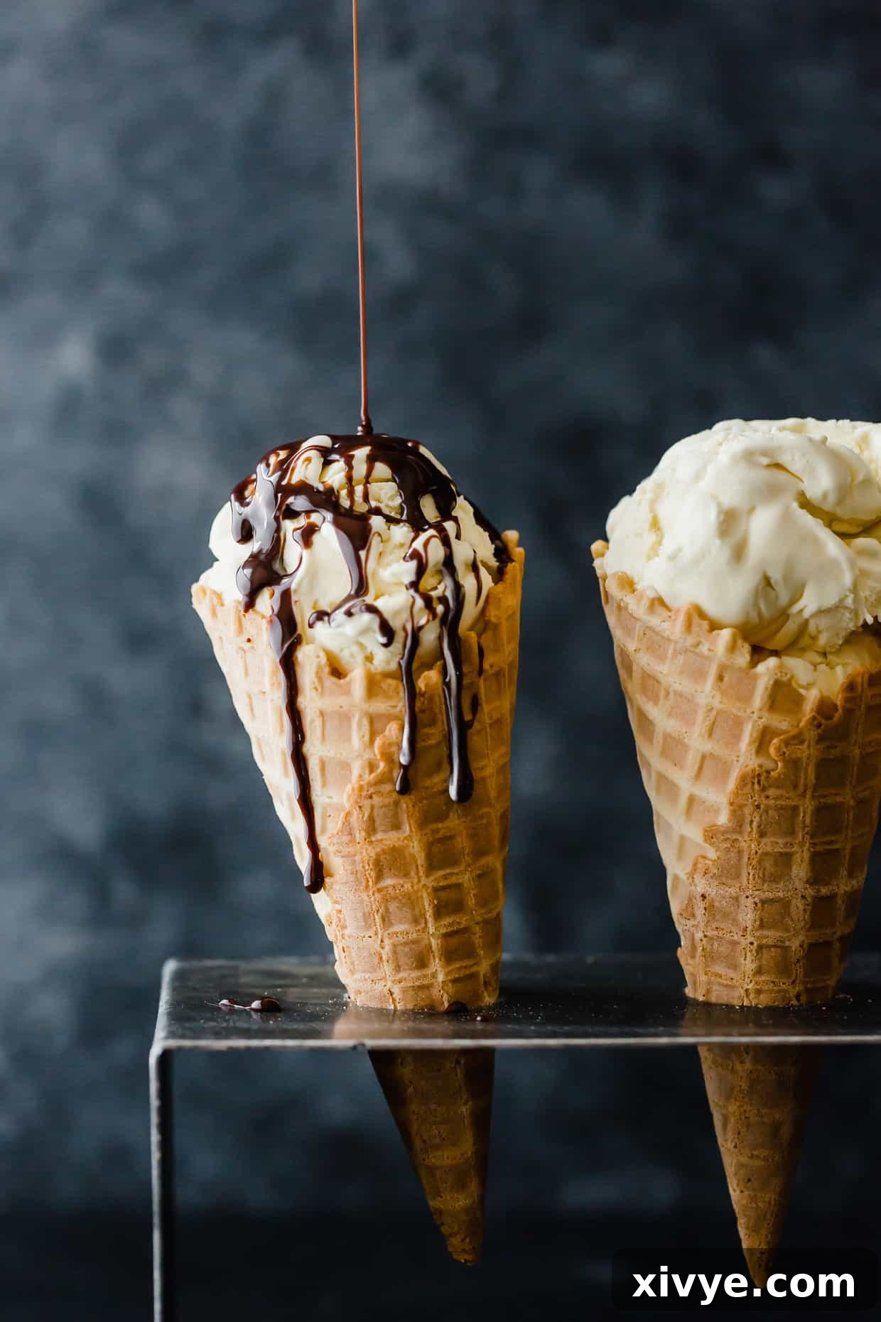 Delicious Homemade Creamy Vanilla Ice Cream. This ice cream is custard based which makes it extra creamy! It's the perfect treat for those hot summer days. Get the full recipe at saltandbaker.com