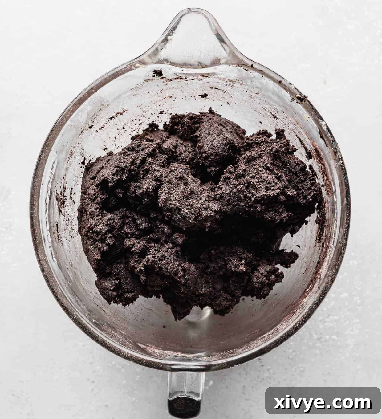 Giant Crumbl Style Chocolate Oreo Cookies 10 A black cookie dough (chocolate Oreo cookie dough) in a mixing bowl.