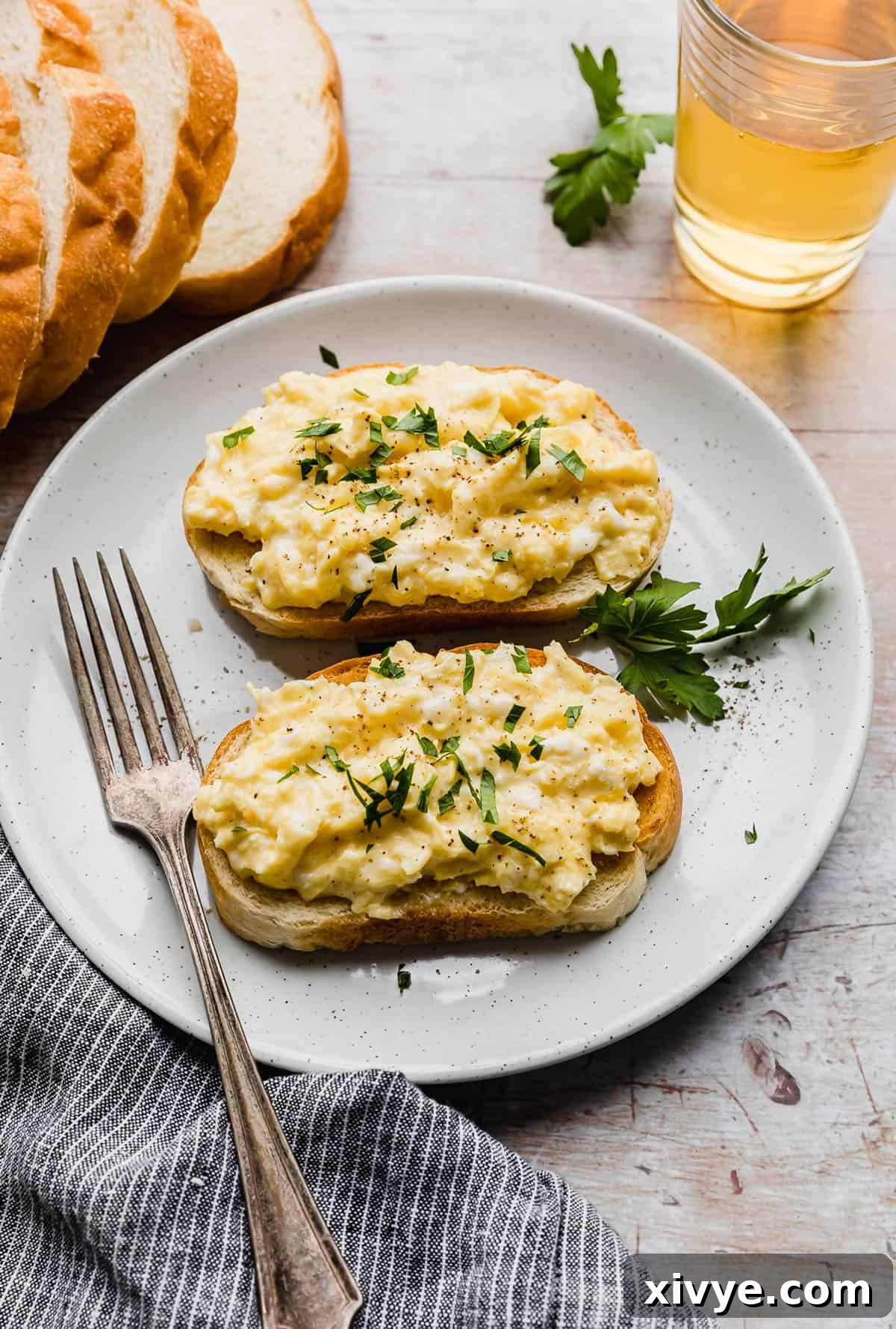 Scrambled Eggs on Toast garnished with fresh parsley.