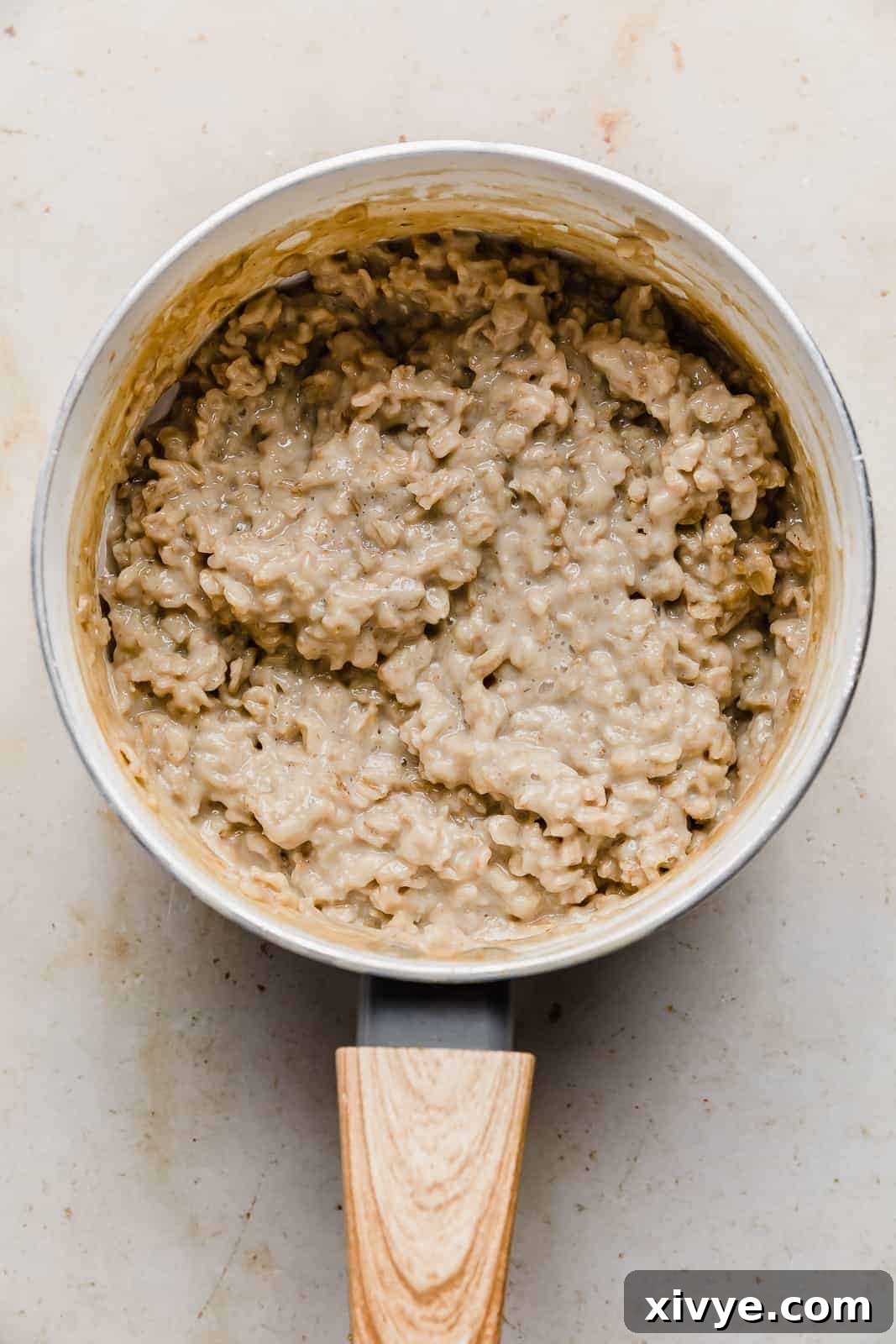 Golden Maple Oat Sweetness 5 Maple and Brown Sugar Oatmeal in a white saucepan.