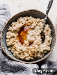 A bowl of oatmeal on a white background.