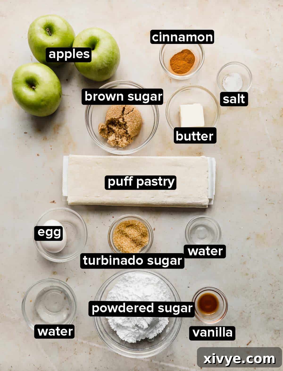 Puff Pastry Apple Turnover ingredients on a cream marbled background.