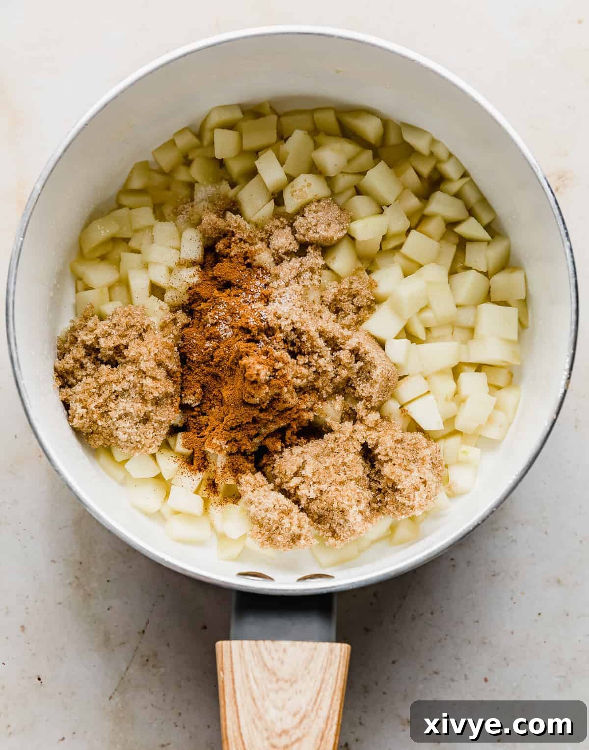 Diced apples with brown sugar, cinnamon overtop.
