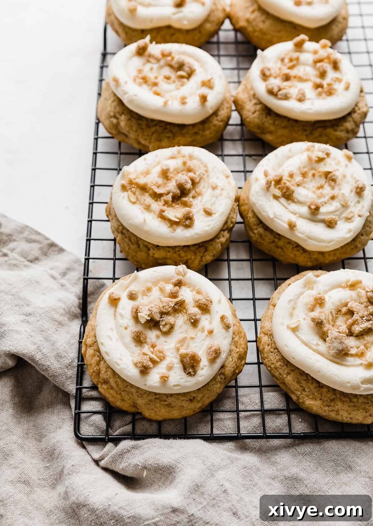 Gooey Caramel Apple Cookies 7 Caramel Apple Cookies on a black wire rack.