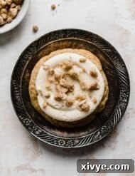 Gooey Caramel Apple Cookies 9 A Caramel Apple Cookie on a vintage black plate.