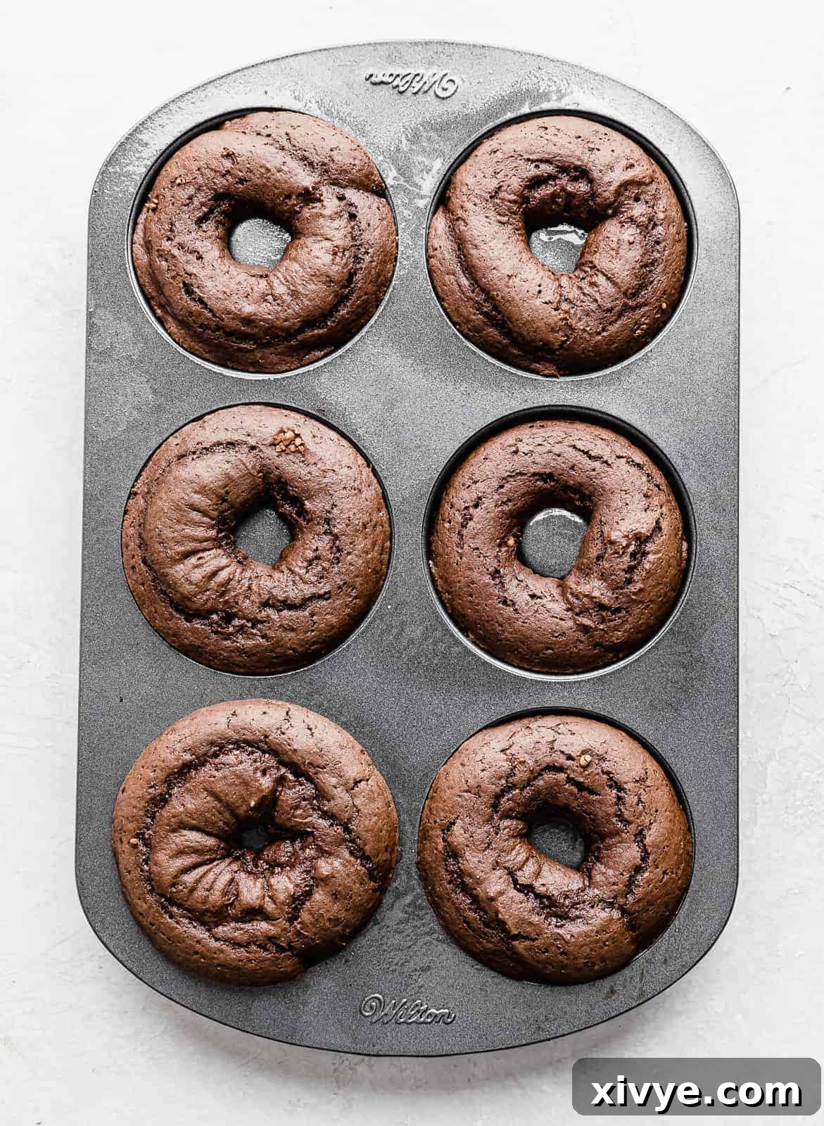 Baked Chocolate Doughnuts in a donut pan.