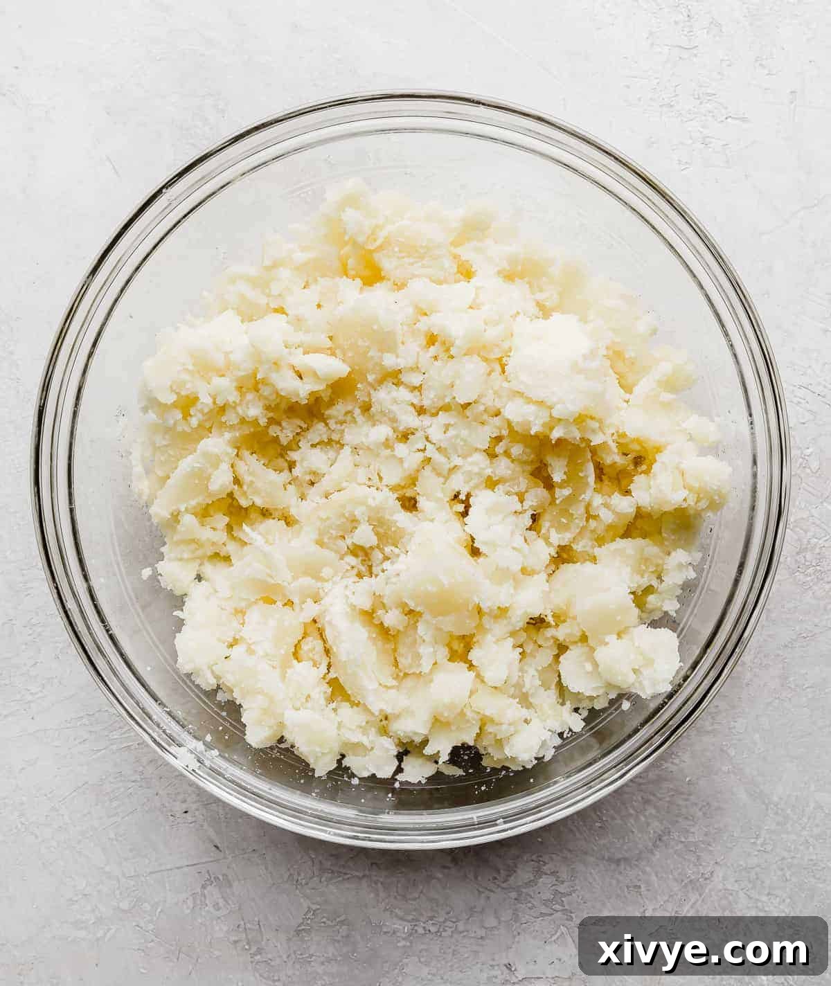 Decadent Double-Baked Potatoes 5 White baked potato mixture in a glass bowl.