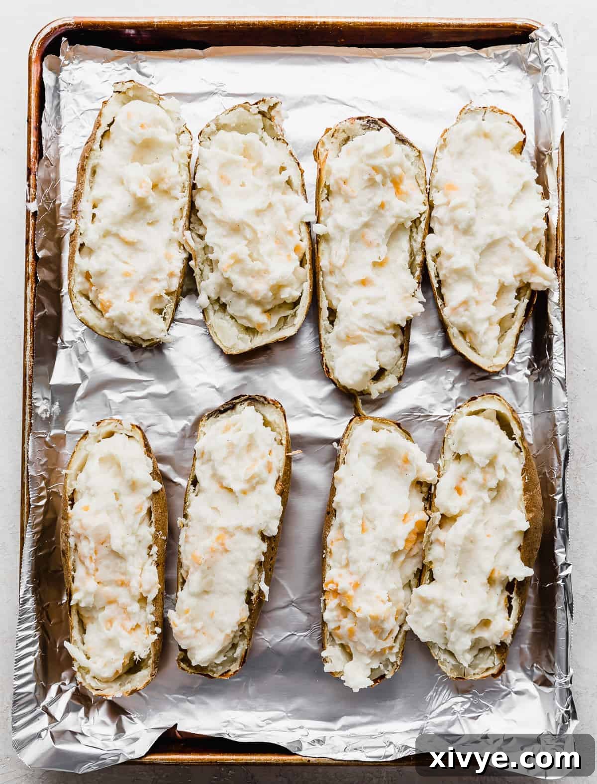 Decadent Double-Baked Potatoes 9 Potato skins filled with Twice Baked Potatoes with Cream Cheese mixture.