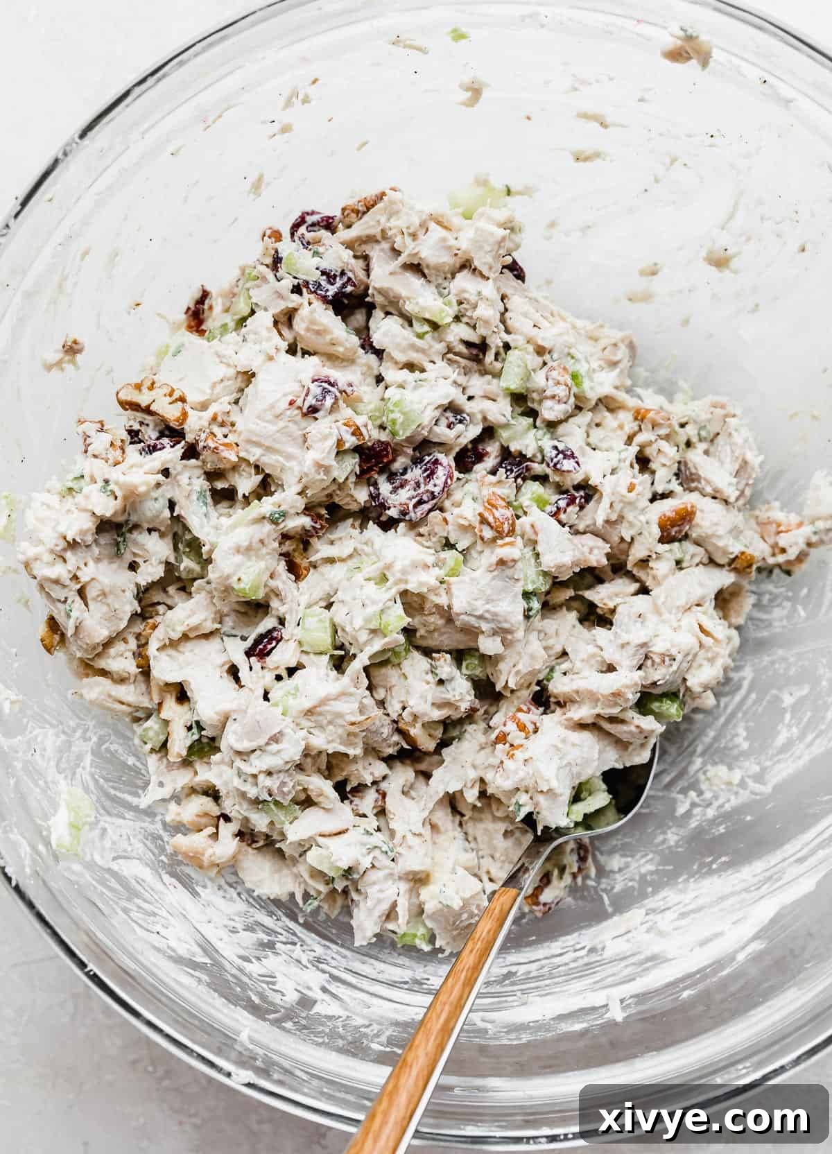 Leftover Cranberry Turkey Salad Sandwich ingredients mixed in a glass bowl.