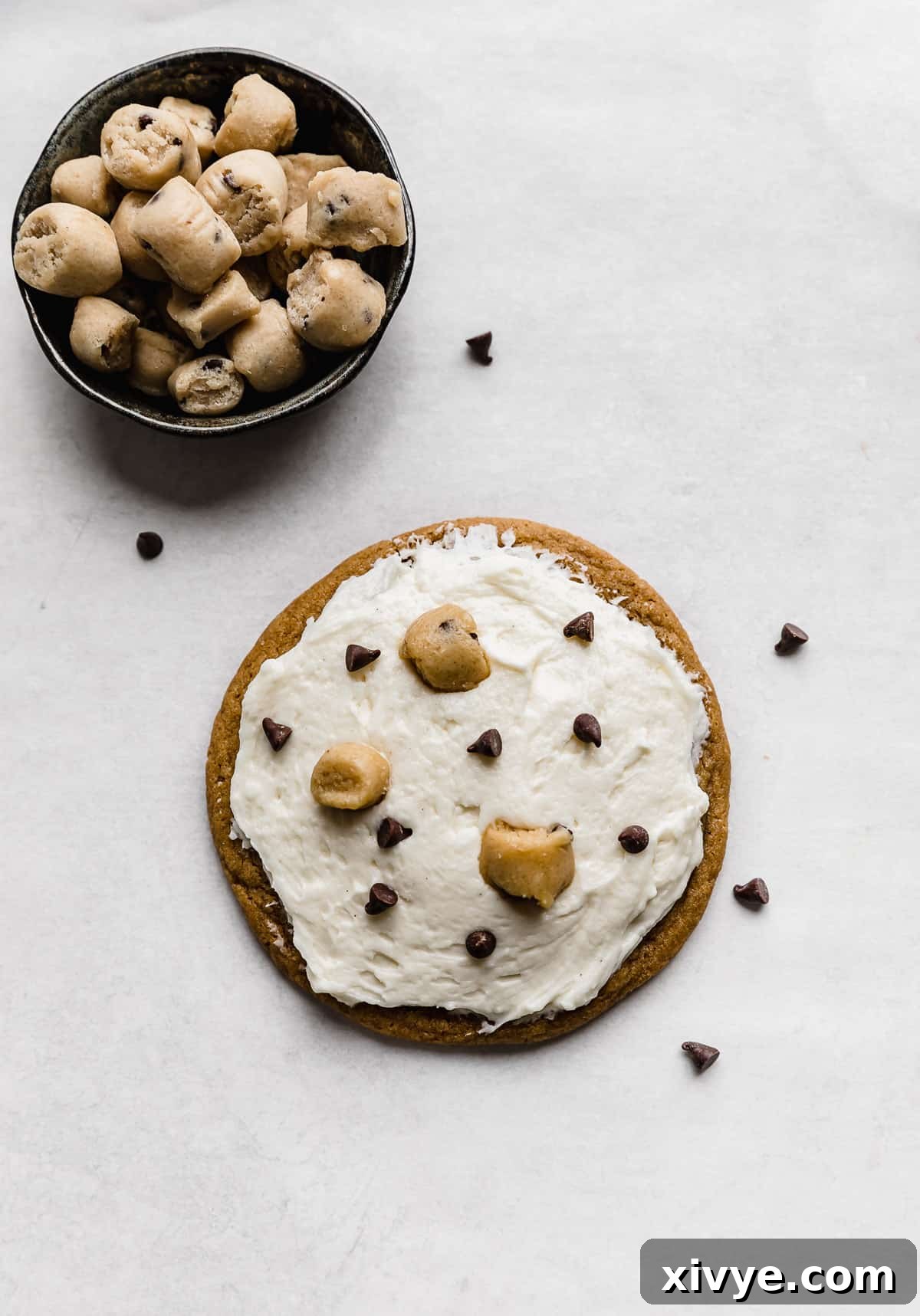 Crumbl Cookie Dough Dream 12 A single Crumbl Cookie Dough Cookie on a white background.