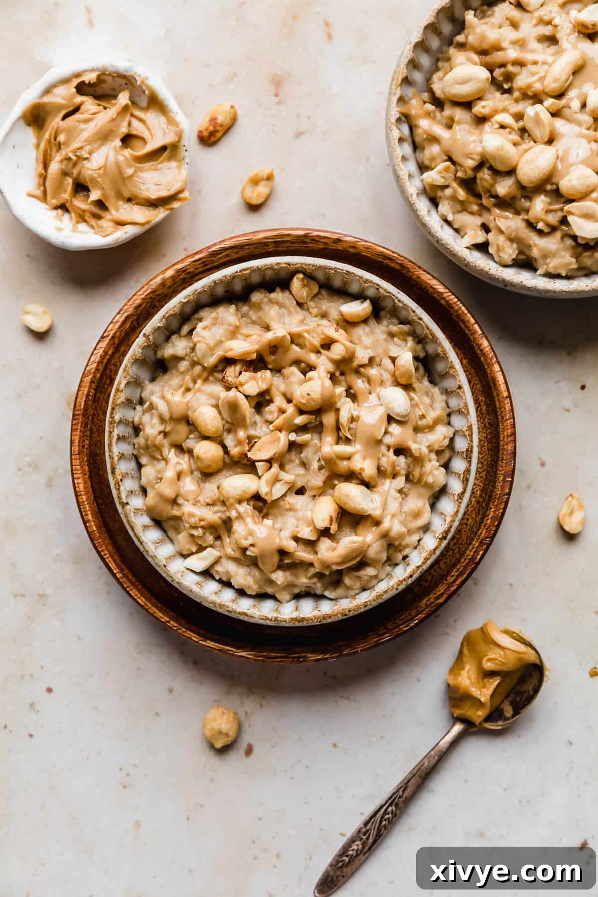 Peanut Butter Oatmeal topped with chopped nuts and melted peanut butter.