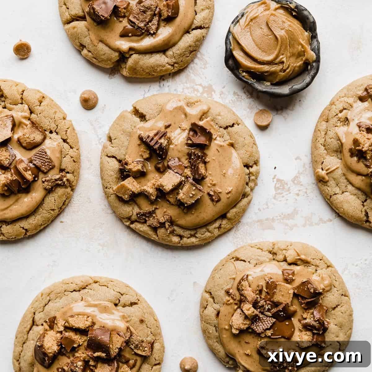 Luxurious Crumbl Peanut Butter Cup Cookies, each featuring a thick peanut butter base, generously topped with melted peanut butter and chopped peanut butter cups.