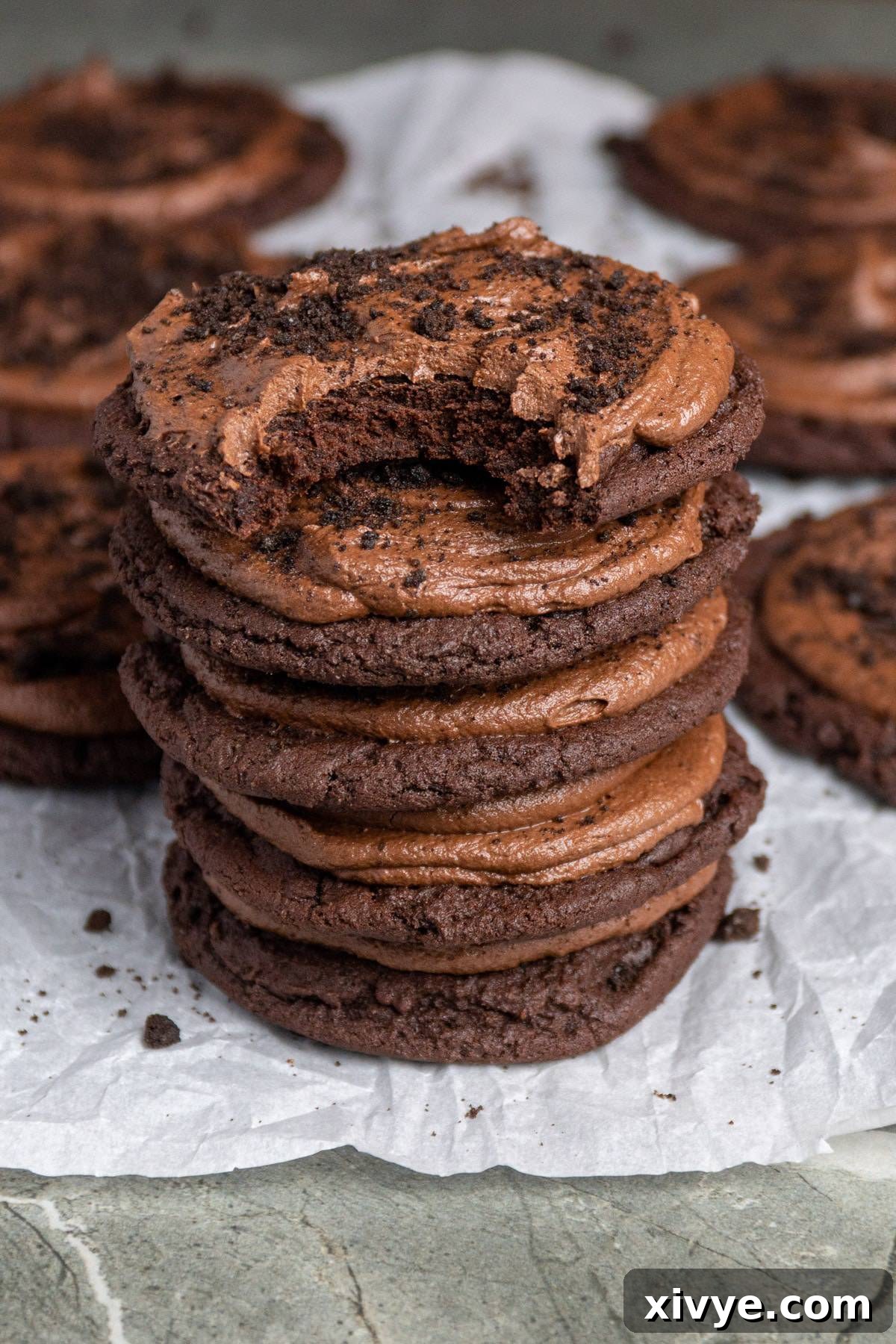 A delightful Copycat Dirt Cake Crumbl Cookie, showcasing a soft chocolate cake-like base, rich chocolate frosting, and generous Oreo crumbs, capturing the essence of the classic dessert.