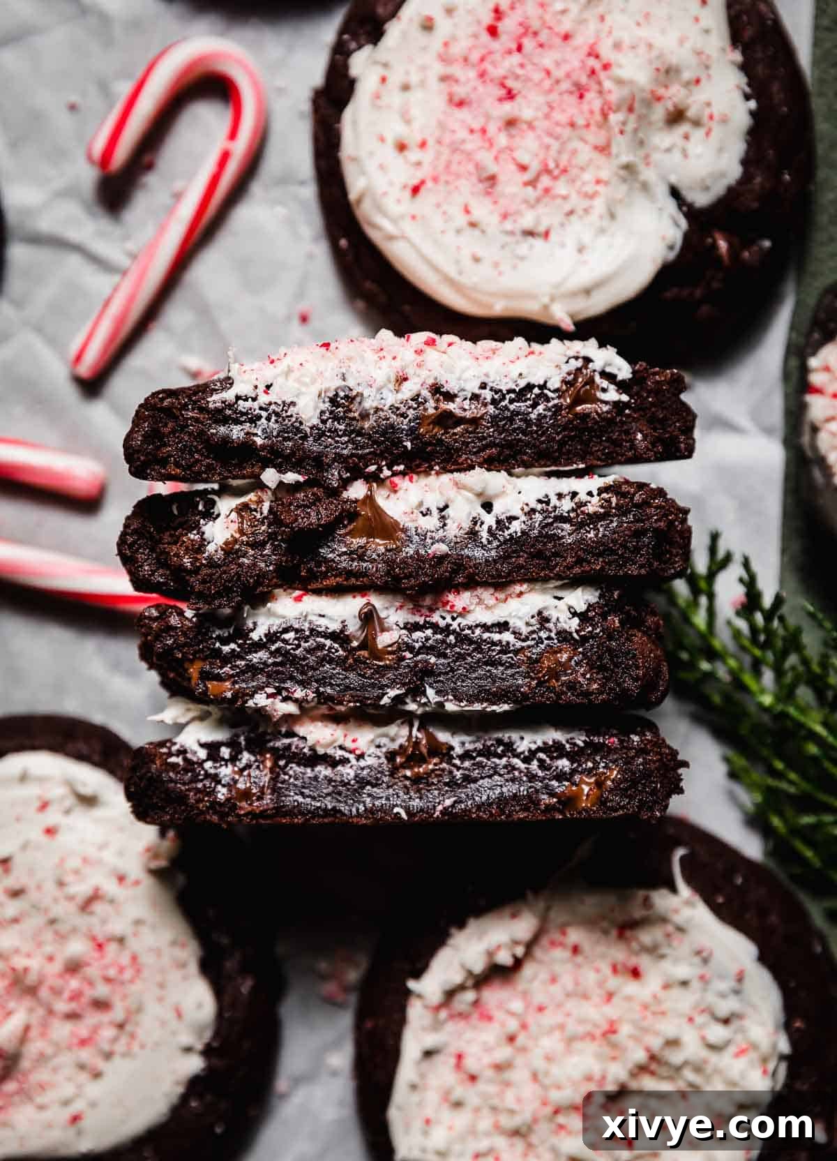 Peppermint Bark Bites 3 Two Peppermint Bark Cookies cut in half, showing the inside gooey centers.