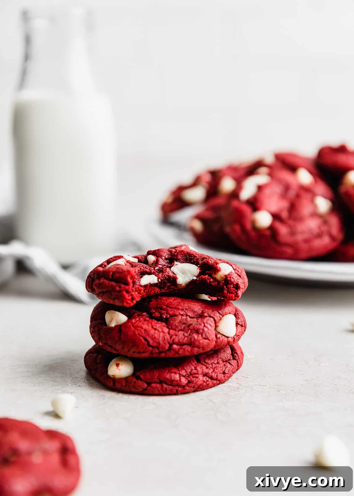 Red Velvet Cake Cookies 2 Red Velvet Cake Mix Cookies stacked on top of 2 cookies against a white background.