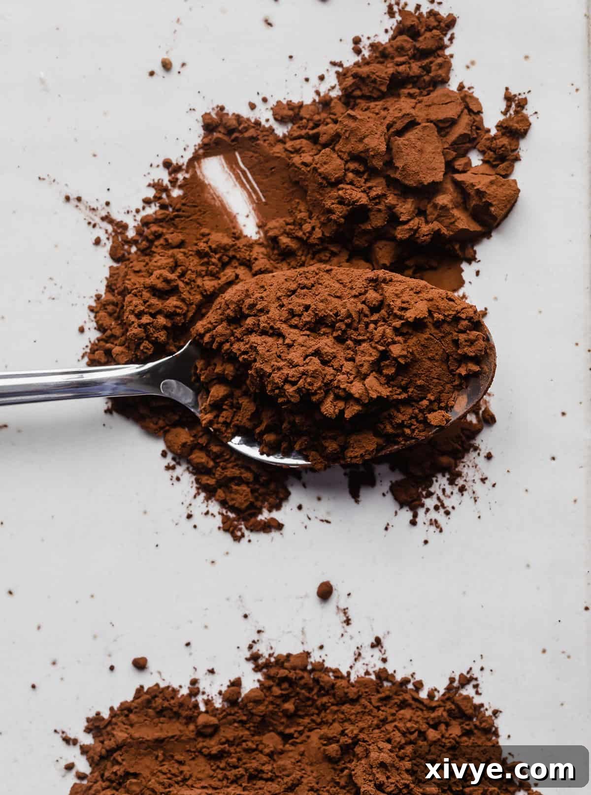 Dutch processed cocoa powder on a spoon.
