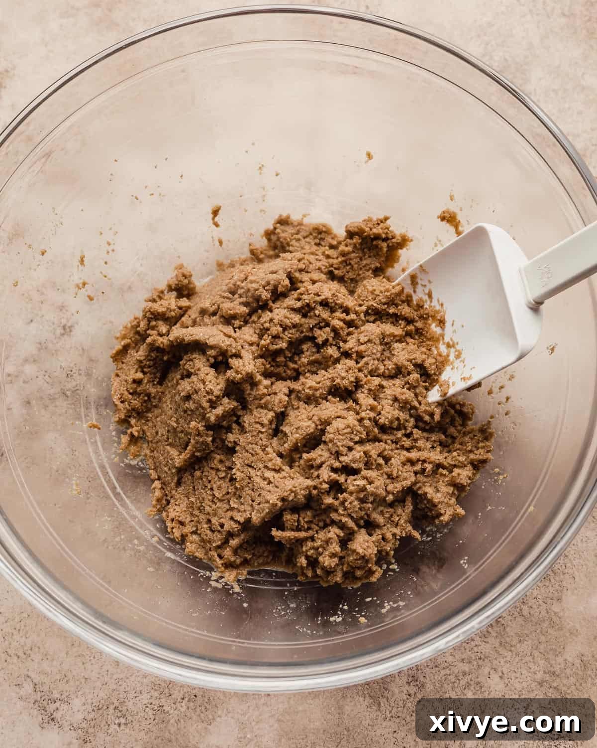 Hearty Buttermilk Bran Muffins 5 All bran cereal soaking in water in a glass bowl.