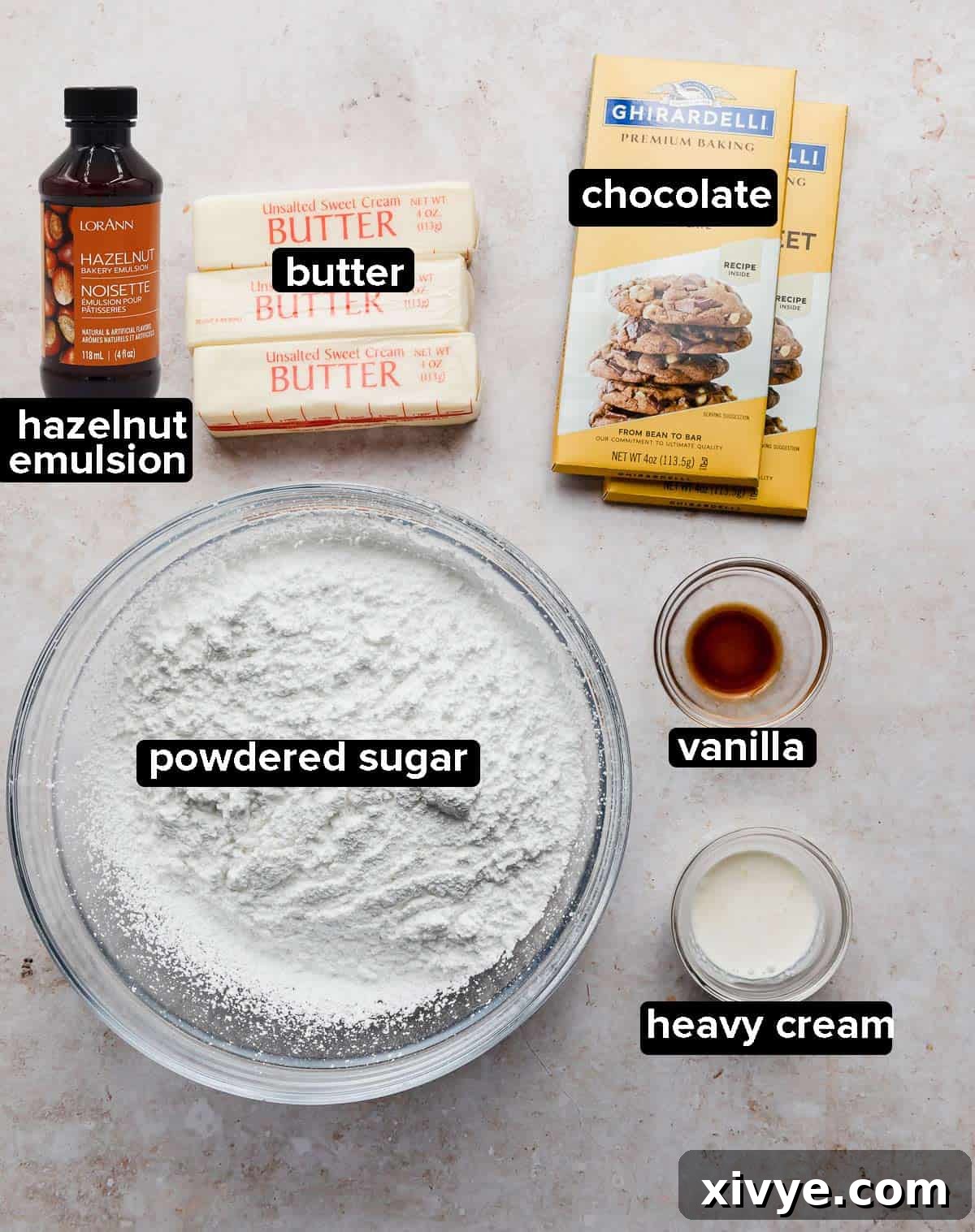 Ingredients used to make Ferrero Rocher Cupcakes on a light cream colored background. 