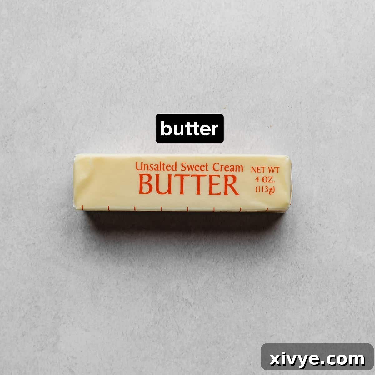 The Secret to Nutty Butter 3 A stick of unsalted butter on a gray background.